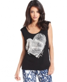 This soft tank from DKNY Jeans is anything but basic. It features a metallic heart and logo design at the front for a bit of flirty style and a cool silhouette for the right downtown edge. This soft tank from DKNY Jeans is anything but basic. It features a metallic heart and logo design at the front for a bit of flirty style and a cool silhouette for the right downtown edge.