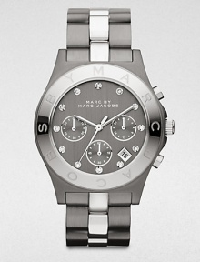 A technical, two-tone stainless steel timepiece with brilliant rhinestone markers. Quartz movementWater resistant to 5 ATMRound gunmetal ion-plated stainless steel case, 40mm (1.6)Logo engraved silvertone ion-plated bezelGunmetal chronograph dialRhinestone hour markersDate display between 4 and 5 o'clockSecond hand Two-tone stainless steel link braceletImported A technical, two-tone stainless steel timepiece with brilliant rhinestone markers. Quartz movementWater resistant to 5 ATMRound gunmetal ion-plated stainless steel case, 40mm (1.6)Logo engraved silvertone ion-plated bezelGunmetal chronograph dialRhinestone hour markersDate display between 4 and 5 o'clockSecond hand Two-tone stainless steel link braceletImported