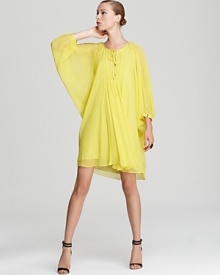 Cut in a voluminous silhouette, this pop-bright DIANE von FURSTENBERG dress transitions from getaway style to city chic with breezy style. Cut in a voluminous silhouette, this pop-bright DIANE von FURSTENBERG dress transitions from getaway style to city chic with breezy style.