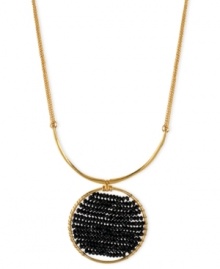 Center of attention. Kenneth Cole New York takes a circular path to style with this necklace. Crafted from gold-tone mixed metal, the pendant stands out with black cherry beads in the middle. Approximate length: 16 inches + 3-inch extender. Approximate drop: 2-1/4 inches. Center of attention. Kenneth Cole New York takes a circular path to style with this necklace. Crafted from gold-tone mixed metal, the pendant stands out with black cherry beads in the middle. Approximate length: 16 inches + 3-inch extender. Approximate drop: 2-1/4 inches.