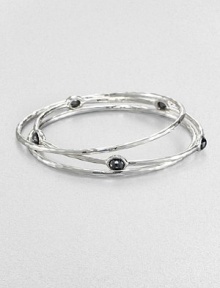 From the Rock Candy® Collection. A trio of hammered, sterling silver bangles accented with rich, faceted hematite. Sterling silverHematiteDiameter, about 2.5Slip-on styleImported From the Rock Candy® Collection. A trio of hammered, sterling silver bangles accented with rich, faceted hematite. Sterling silverHematiteDiameter, about 2.5Slip-on styleImported