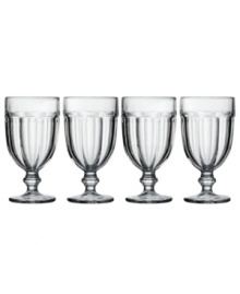 Just calling for lemonade, sweet tea or a big scoop of strawberry ice cream, this set of versatile iced beverage drinking glasses tops casual tables with vintage charm. Featuring a fluted, footed design in clear glass. Just calling for lemonade, sweet tea or a big scoop of strawberry ice cream, this set of versatile iced beverage drinking glasses tops casual tables with vintage charm. Featuring a fluted, footed design in clear glass.