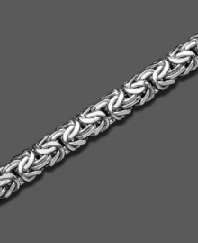 A 14k white gold bracelet with smooth, sensuous style. Approximate length: 8 inches. A 14k white gold bracelet with smooth, sensuous style. Approximate length: 8 inches.