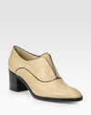 Timeless oxford in fine Italian leather with contrasting trim. Stacked heel, 2¼ (60mm)Leather upperLeather lining and solePadded insoleMade in ItalyOUR FIT MODEL RECOMMENDS ordering one half size up as this style runs small. 