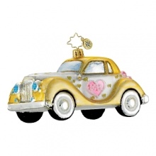 A golden, glittering car holiday ornament. A golden, glittering car holiday ornament.
