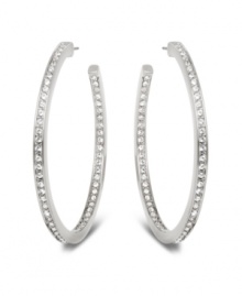 Stellar style fit for a celebrity. This elegant pair of silver tone mixed metal hoop earrings sparkles in clear Swarovski crystal pavé and reflects the light in a thousand facets. These unique earrings add a touch of sophistication to your look. Approximate diameter: 1-7/8 inches. Stellar style fit for a celebrity. This elegant pair of silver tone mixed metal hoop earrings sparkles in clear Swarovski crystal pavé and reflects the light in a thousand facets. These unique earrings add a touch of sophistication to your look. Approximate diameter: 1-7/8 inches.