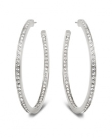 Stellar style fit for a celebrity. This elegant pair of silver tone mixed metal hoop earrings sparkles in clear Swarovski crystal pavé and reflects the light in a thousand facets. These unique earrings add a touch of sophistication to your look. Approximate diameter: 1-7/8 inches.