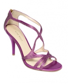 Sultry satin and brilliant rhinestones are the perfect pair. The Altemis dress sandals by Nine West feature sexy, crisscrossing straps across the vamp and zipper detail at the back. Sultry satin and brilliant rhinestones are the perfect pair. The Altemis dress sandals by Nine West feature sexy, crisscrossing straps across the vamp and zipper detail at the back.