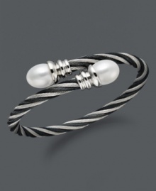 Wrap your wrists in polished perfection. This coil-shaped bangle bracelet features white cultured freshwater pearls (10-11 mm) set in twisted stainless steel. Approximate length: 8 inches. Wrap your wrists in polished perfection. This coil-shaped bangle bracelet features white cultured freshwater pearls (10-11 mm) set in twisted stainless steel. Approximate length: 8 inches.
