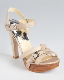 Resting atop a stacked platform, the MICHAEL Michael Kors Grace sandals stand out with stitched details at the heel. Resting atop a stacked platform, the MICHAEL Michael Kors Grace sandals stand out with stitched details at the heel.