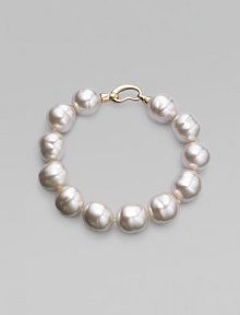 An elegant strand of white organic pearls, with a graceful clasp. 14mm white baroque man-made pearls Length, about 8 18k goldplated sterling silver spring clip clasp Made in Spain An elegant strand of white organic pearls, with a graceful clasp. 14mm white baroque man-made pearls Length, about 8 18k goldplated sterling silver spring clip clasp Made in Spain