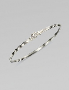 From the Cable Collectibles Collection. Thin sterling silver band with delicate diamond pavé heart.Diamond, 0.11 tcw Sterling silver Width, about 3mm Hook closure Imported From the Cable Collectibles Collection. Thin sterling silver band with delicate diamond pavé heart.Diamond, 0.11 tcw Sterling silver Width, about 3mm Hook closure Imported