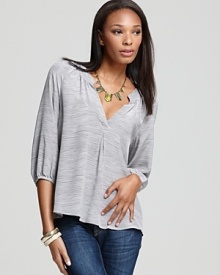 A polished Joie top with a smocked split neckline and pleat at the center tops off weekend denim with polished ease, replacing the off-duty tee with comfortable chic. A polished Joie top with a smocked split neckline and pleat at the center tops off weekend denim with polished ease, replacing the off-duty tee with comfortable chic.