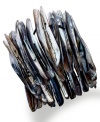 Seaside style with an edge. Gray shells in spike-designs create a chic bracelet by Ali Khan. Held together by a stretch cord. Stretches to fit wrist. Approximate length: 7 inches. Approximate diameter: 3-1/2 inches.