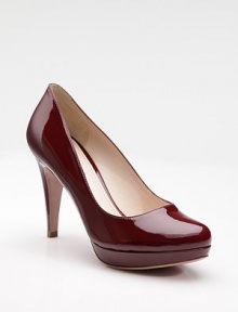 Patent leather platform pump with rounded toe.Self-covered heel, 4 Self-covered platform, ¾ Compares to a 3¼ heel Leather lining and sole Padded insole Made in ItalyOUR FIT MODEL RECOMMENDS ordering true size. Patent leather platform pump with rounded toe.Self-covered heel, 4 Self-covered platform, ¾ Compares to a 3¼ heel Leather lining and sole Padded insole Made in ItalyOUR FIT MODEL RECOMMENDS ordering true size.