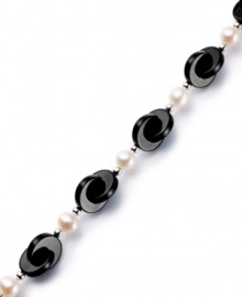 Striking contrast. Overlapping onyx discs (12 mm) combine with cultured freshwater pearls (6-1/2-7 mm) for a bold and elegant look. Set in sterling silver. Approximate length: 7-1/2 inches. Striking contrast. Overlapping onyx discs (12 mm) combine with cultured freshwater pearls (6-1/2-7 mm) for a bold and elegant look. Set in sterling silver. Approximate length: 7-1/2 inches.