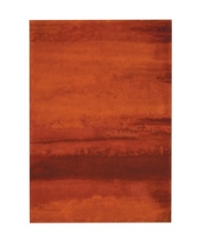 Abstract and dramatic, this handcrafted wool rug features a rich spectrum of shades from burnt orange tones to deep reds. The ethereal coloration pattern is reminiscent of a vivid sky at sunset. Luster-wash finish creates gently-diffused color variation. Abstract and dramatic, this handcrafted wool rug features a rich spectrum of shades from burnt orange tones to deep reds. The ethereal coloration pattern is reminiscent of a vivid sky at sunset. Luster-wash finish creates gently-diffused color variation.