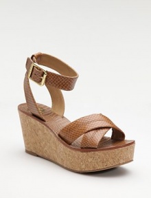 Exotic looking, snake-embossed leather crisscrosses the toes, wraps the ankle and sits on a cork wedge.Cork heel, 3 (75mm) Cork platform, 1½ (40mm) Compares to a 1½ (40mm) Buckle ankle strap Leather lining Rubber sole Imported Exotic looking, snake-embossed leather crisscrosses the toes, wraps the ankle and sits on a cork wedge.Cork heel, 3 (75mm) Cork platform, 1½ (40mm) Compares to a 1½ (40mm) Buckle ankle strap Leather lining Rubber sole Imported