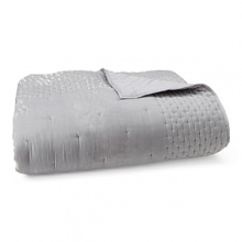 A plush, tufted silver velvet coverlet adds a dose of pure luxury to the Ornamental Scroll collection. A plush, tufted silver velvet coverlet adds a dose of pure luxury to the Ornamental Scroll collection.