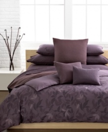 A sweet design. Wine and plum colored elements compose the Elm comforter set from Calvin Klein. A muted landscape of leaves add a touch of modern sophistication.