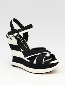 Boldly striped canvas wedge with an adjustable, wrap-around ankle strap. Self-covered wedge, 5 (125mm)Covered platform, 2 (50mm)Compares to a 3 heel (75mm)Striped canvas upperLeather liningBuffed leather solePadded insolePattern may varyImportedOUR FIT MODEL RECOMMENDS ordering one half size up as this style runs small. Boldly striped canvas wedge with an adjustable, wrap-around ankle strap. Self-covered wedge, 5 (125mm)Covered platform, 2 (50mm)Compares to a 3 heel (75mm)Striped canvas upperLeather liningBuffed leather solePadded insolePattern may varyImportedOUR FIT MODEL RECOMMENDS ordering one half size up as this style runs small.