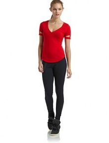 THE LOOKV-neckShort sleevesCutout details at cuffs with stud accentsCurved hemTHE FITAbout 37 from shoulder to hemTHE MATERIALMicromodal/spandexCARE & ORIGINMachine washMade in USAModel shown is 5'8 (172½cm) wearing US size Small. THE LOOKV-neckShort sleevesCutout details at cuffs with stud accentsCurved hemTHE FITAbout 37 from shoulder to hemTHE MATERIALMicromodal/spandexCARE & ORIGINMachine washMade in USAModel shown is 5'8 (172½cm) wearing US size Small.
