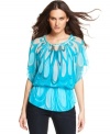 An elegant marbled print on sheer chiffon fabric takes INC's top to new heights of style!