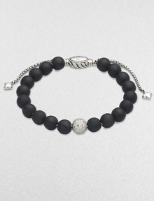 Rich black onyx, accented by a brilliant pavé diamond ball, is fastened by an adjustable clasp of textured sterling silver.Diamonds, 0.87 tcw Black onyx Sterling silver Bead diameter, about ¾ Imported