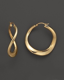 A twist on the classic hoop, these 14K. yellow gold earrings are luxe and modern. A twist on the classic hoop, these 14K. yellow gold earrings are luxe and modern.