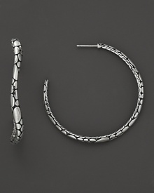 Undulating hoops resemble a handful of gleaming pebbles, sculpted in sterling silver. From the Kali collection. Undulating hoops resemble a handful of gleaming pebbles, sculpted in sterling silver. From the Kali collection.