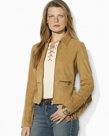 Western inspiration comes to life in a supple suede jacket, accented with a cascade of fringe along the arms and back. Western inspiration comes to life in a supple suede jacket, accented with a cascade of fringe along the arms and back.