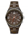 Earthy brown lends a unique touch to the sporty Cambridge watch by adidas. Translucent brown plastic bracelet and round brown nylon case with silver tone and brown aluminum bezel. Brown grid-patterned dial features applied numerals and stick indices, minute track, date window, three multifunctional subdials, three hands, logo and orange accents. Quartz movement. Water resistant to 50 meters. Two-year limited warranty.