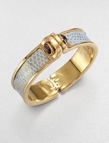 Edgy and exotic, this design is centered with a strip of gold-washed lizard with turquoise-colored accents, the bold polished cuff linked with domes of amethyst.AmethystLizardGoldplated brassDiameter, about 2.5Width, about 1Hinged and claspedMade in USA Edgy and exotic, this design is centered with a strip of gold-washed lizard with turquoise-colored accents, the bold polished cuff linked with domes of amethyst.AmethystLizardGoldplated brassDiameter, about 2.5Width, about 1Hinged and claspedMade in USA