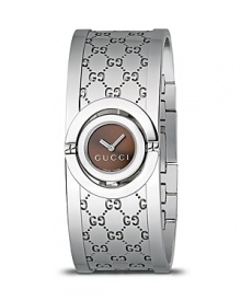 A cuff watch from the Gucci Twirl collection. With logo designed steel bangle strap, brown sun-brushed dial and jewelry clasp. A cuff watch from the Gucci Twirl collection. With logo designed steel bangle strap, brown sun-brushed dial and jewelry clasp.