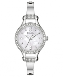 A beautiful, retro-inspired watch with everlasting glamor. Silvertone stainless steel bangle bracelet and round case with crystal accents. Round mother-of-pearl dial with logo and stick indices. Quartz movement. Water resistant to 30 meters. Three-year limited warranty.