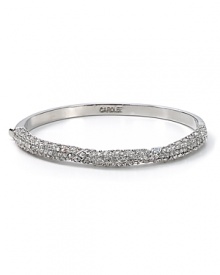 Put on the glamour this season with this striking silver and crystal bangle from Carolee, sure to add sophisticated sparkle to every outfit. Put on the glamour this season with this striking silver and crystal bangle from Carolee, sure to add sophisticated sparkle to every outfit.