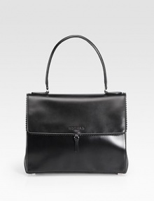 Sumptuously-sleek leather in a demure flap silhouette, edged with scalloped trim.Top handle, 6½ dropMagnetic snap flap closureProtective metal feetOne inside zip pocketOne inside open pocketLeather lining11¾W X 9½H X 5¾DMade in Italy Sumptuously-sleek leather in a demure flap silhouette, edged with scalloped trim.Top handle, 6½ dropMagnetic snap flap closureProtective metal feetOne inside zip pocketOne inside open pocketLeather lining11¾W X 9½H X 5¾DMade in Italy