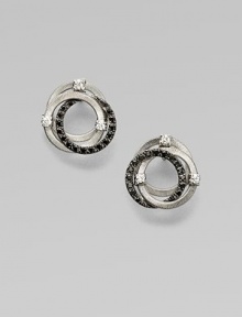 Sparkle in this white and black diamond accented 18k white gold design with interlocking rings. 18k white goldWhite and black diamonds, .42 tcwSize, about ½Post backMade in Italy Sparkle in this white and black diamond accented 18k white gold design with interlocking rings. 18k white goldWhite and black diamonds, .42 tcwSize, about ½Post backMade in Italy