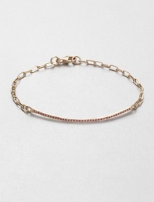 A row of petite ruby stones set in 14k rose gold on a link chain. Ruby14k rose goldLength, about 6.75Lobster clasp closure closureImported A row of petite ruby stones set in 14k rose gold on a link chain. Ruby14k rose goldLength, about 6.75Lobster clasp closure closureImported