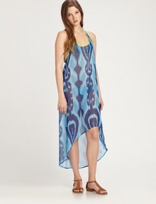 This voluminous, semi-sheer style features a bright ikat print and an asymmetrical hem. ScoopneckSleevelessRacerbackContrast pipingAsymmetrical hemAbout 50 from shoulder to hemPolyesterHand washMade in USA of imported fabrics This voluminous, semi-sheer style features a bright ikat print and an asymmetrical hem. ScoopneckSleevelessRacerbackContrast pipingAsymmetrical hemAbout 50 from shoulder to hemPolyesterHand washMade in USA of imported fabrics