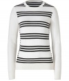 Stylishly striped in bold black and white, Theorys graphic pullover lends a cool modern edge to every outfit - Round neckline, long sleeves, fine ribbed trim - Slim fit - Wear with a crewneck tee, skinnies and flats