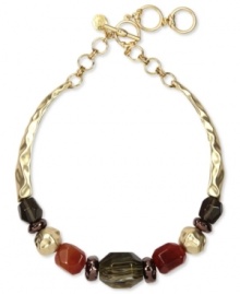 Drape you neckline in warm tones. Jones New York's collar necklace boasts multi-colored resin beads on a textured surface. Crafted in worn gold tone mixed metal. Approximate length: 17 inches + 3-inch extender.