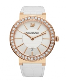 In perfect harmony. Supple leather and rosy metal tones combine on this Citra watch by Swarovski. White croc-embossed leather strap and round rose-gold PVD stainless steel case. Bezel crystallized with Swarovski elements. Silvery white sunray dial with textured inner dial features applied rose-gold tone stick indices, date window at six o'clock, logo at twelve o'clock and two hands. Swiss quartz movement. Water resistant to 30 meters. Two-year limited warranty. In perfect harmony. Supple leather and rosy metal tones combine on this Citra watch by Swarovski. White croc-embossed leather strap and round rose-gold PVD stainless steel case. Bezel crystallized with Swarovski elements. Silvery white sunray dial with textured inner dial features applied rose-gold tone stick indices, date window at six o'clock, logo at twelve o'clock and two hands. Swiss quartz movement. Water resistant to 30 meters. Two-year limited warranty.