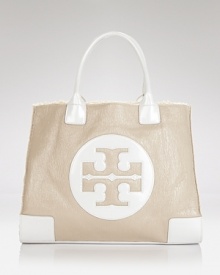 Undeniably effortless, Tory Burch's must-have tote shines on in patent leather. Undeniably effortless, Tory Burch's must-have tote shines on in patent leather.