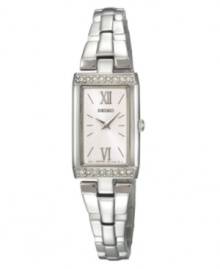 Make a striking impression with this timeless design by Seiko. Watch crafted of stainless steel bracelet and baguette-shaped case. Bezel crystallized with Swarovski elements at top and bottom. Silver tone dial features applied silver tone Roman numerals at twelve and six o'clock, stick indices, two hands and logo. Quartz movement. Water resistant to 30 meters. Three-year limited warranty. Make a striking impression with this timeless design by Seiko. Watch crafted of stainless steel bracelet and baguette-shaped case. Bezel crystallized with Swarovski elements at top and bottom. Silver tone dial features applied silver tone Roman numerals at twelve and six o'clock, stick indices, two hands and logo. Quartz movement. Water resistant to 30 meters. Three-year limited warranty.
