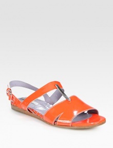 Ideal for goddess-like dresses or flirty jumpsuits, this gleaming patent leather flat has metallic leather trim and an adjustable ankle strap. Patent leather upperLeather lining and solePadded insoleImportedOUR FIT MODEL RECOMMENDS ordering true whole size; ½ sizes should order the next whole size up. 