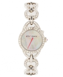 Bow-tie your outfit together with a little treasure from Betsey Johnson. Watch crafted of stainless steel heart-shaped link bracelet encrusted with crystal accents and round stainless steel case. Bow-topped bezel embellished with crystal accents. White mother-of-pearl dial features silver tone Roman numerals at twelve, three, six and nine o'clock, silver tone hour and minute hands, fuchsia second hand and logo. Quartz movement. Water resistant to 30 meters. Two-year limited warranty. Bow-tie your outfit together with a little treasure from Betsey Johnson. Watch crafted of stainless steel heart-shaped link bracelet encrusted with crystal accents and round stainless steel case. Bow-topped bezel embellished with crystal accents. White mother-of-pearl dial features silver tone Roman numerals at twelve, three, six and nine o'clock, silver tone hour and minute hands, fuchsia second hand and logo. Quartz movement. Water resistant to 30 meters. Two-year limited warranty.
