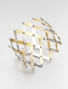 Silver studs connect bands of sterling silver, some with goldplating, in a striking wide, woven trellis pattern.Sterling silver and 18k goldplated sterling silverDiameter, about 4 (adjustable)Width, about 2¼Made in Italy Silver studs connect bands of sterling silver, some with goldplating, in a striking wide, woven trellis pattern.Sterling silver and 18k goldplated sterling silverDiameter, about 4 (adjustable)Width, about 2¼Made in Italy
