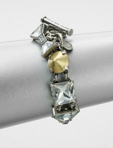 A modern mix of faceted rhinestones and conical, metal studs set in a linked design. Glass stonesOxidized zinc and brassLength, about 7.5Toggle closureImported A modern mix of faceted rhinestones and conical, metal studs set in a linked design. Glass stonesOxidized zinc and brassLength, about 7.5Toggle closureImported