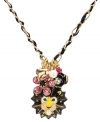 Wildly wearable. Betsey Johnson's chic charm pendant features a yellow enamel lion with crystal accents, a pink glitter flower, flower and bubble heart charms, glass pearls and a small pink crystal accent. Set in gold tone mixed metal with threaded black detailing. Approximate length: 16 inches + 3-inch extender. Approximate drop: 1-1/2 inches.